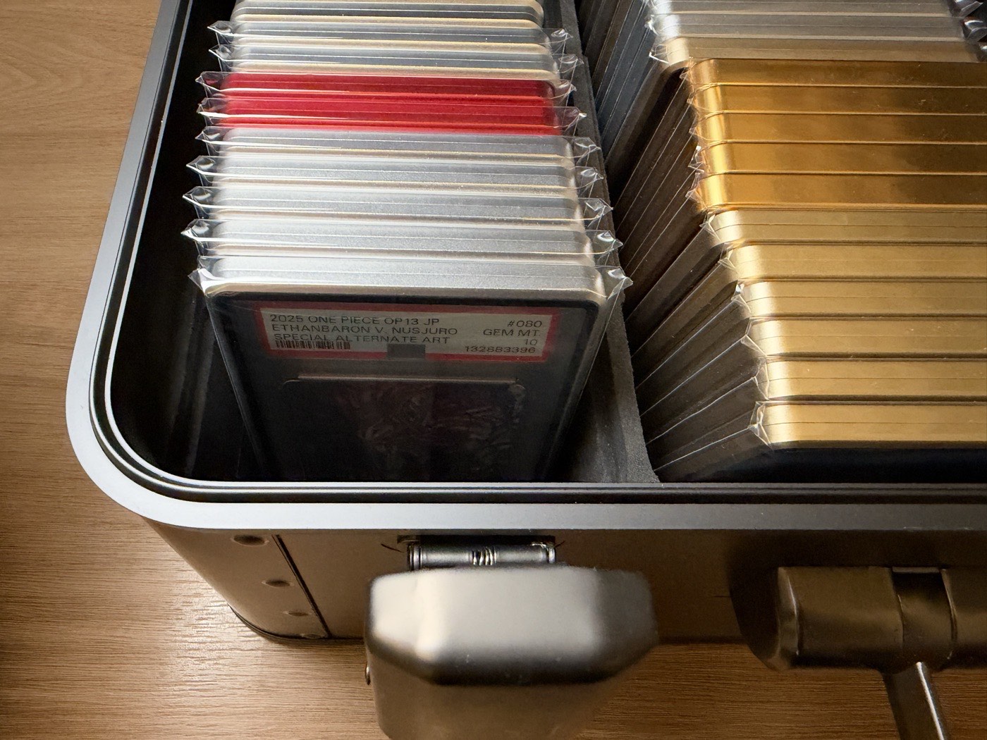 Close-up of graded slabs seated in a Kalijoy K CASE tray, showing the fit tolerance at the slot edges.